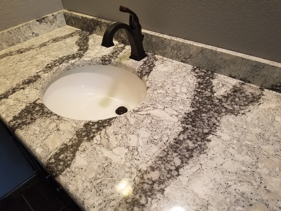 Bathroom vanity and faucet plumbing by Fine Line Plumbing & Heating